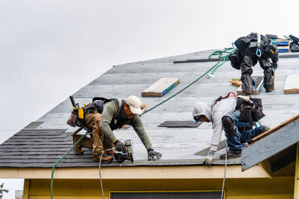 Professional Gutter Installation technician working in Lancaster, MA